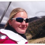 On the chair lift in a sit ski looking at the view
